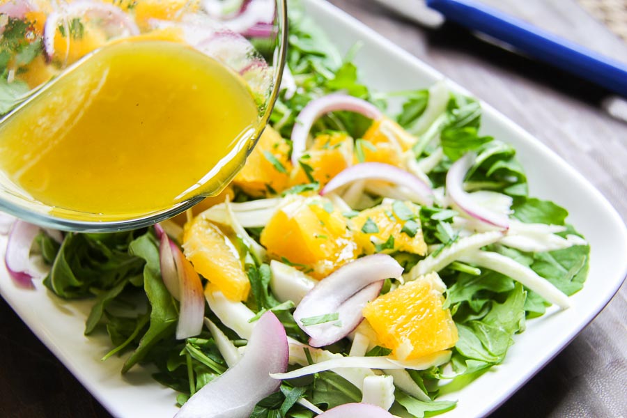 dressing arugula fennel salad with citrus